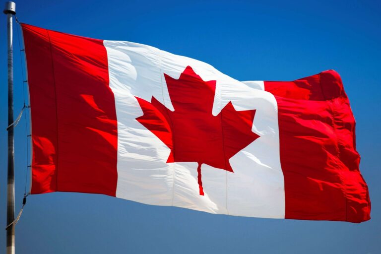 flag-of-canada-on-a-flagpole-canadian-flag-blue-sky-canada-north-america-besthqwallpapers.com-1920×1080