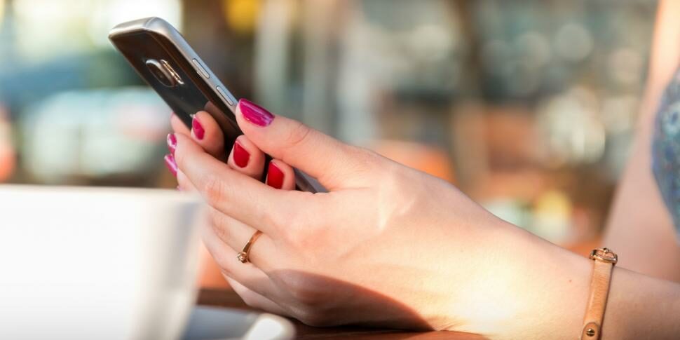 female-hands-with-smartphone-